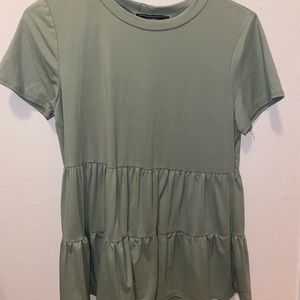 Green round neck top.